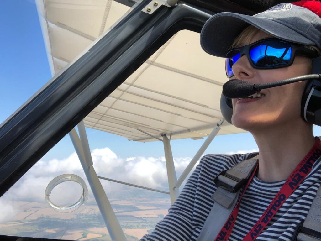 Photo of Charlotte flying a plane